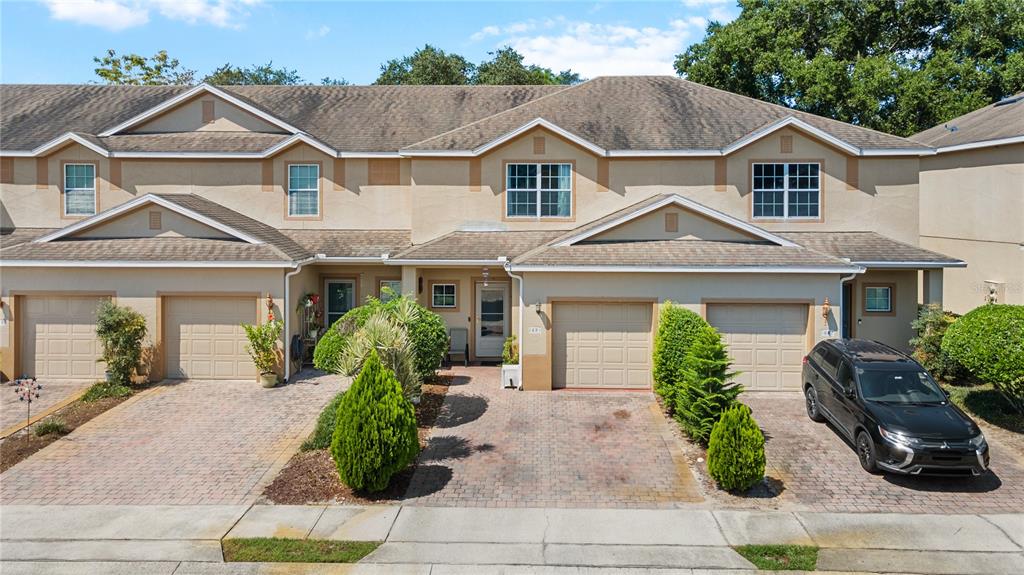 a front view of a house with garden