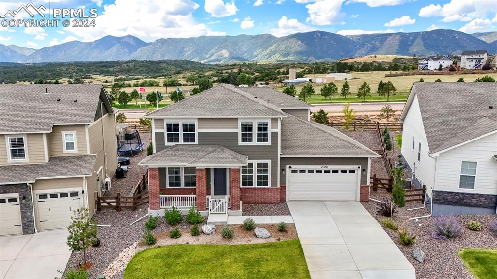 an aerial view of a house with yard swimming pool and outdoor seating