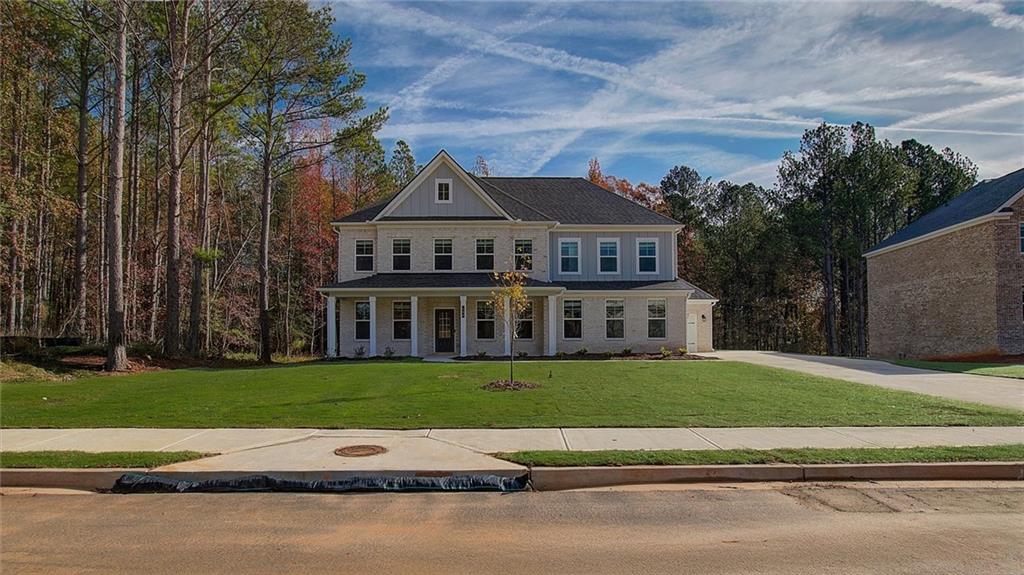 front view of a house with a yard