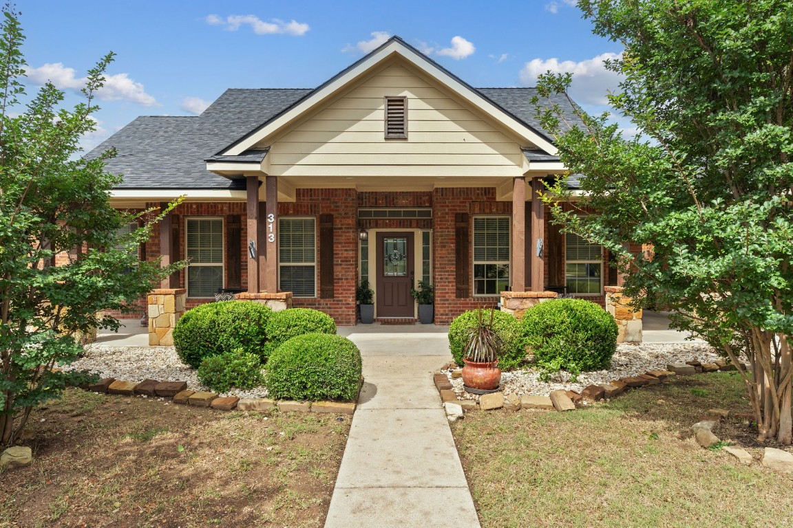 Nestled in a charming, rapidly growing small town in Liberty Hill, this single-story brick home exudes a warm, inviting atmosphere.