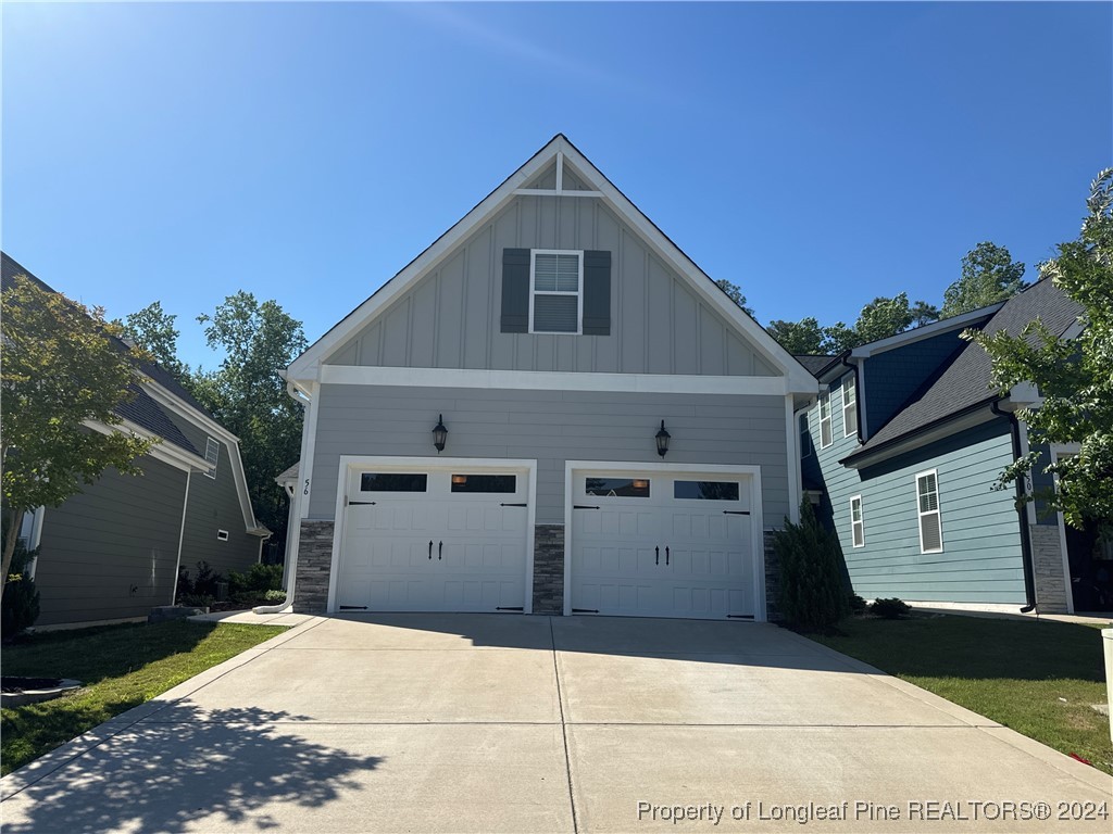 a front view of a house with a garage