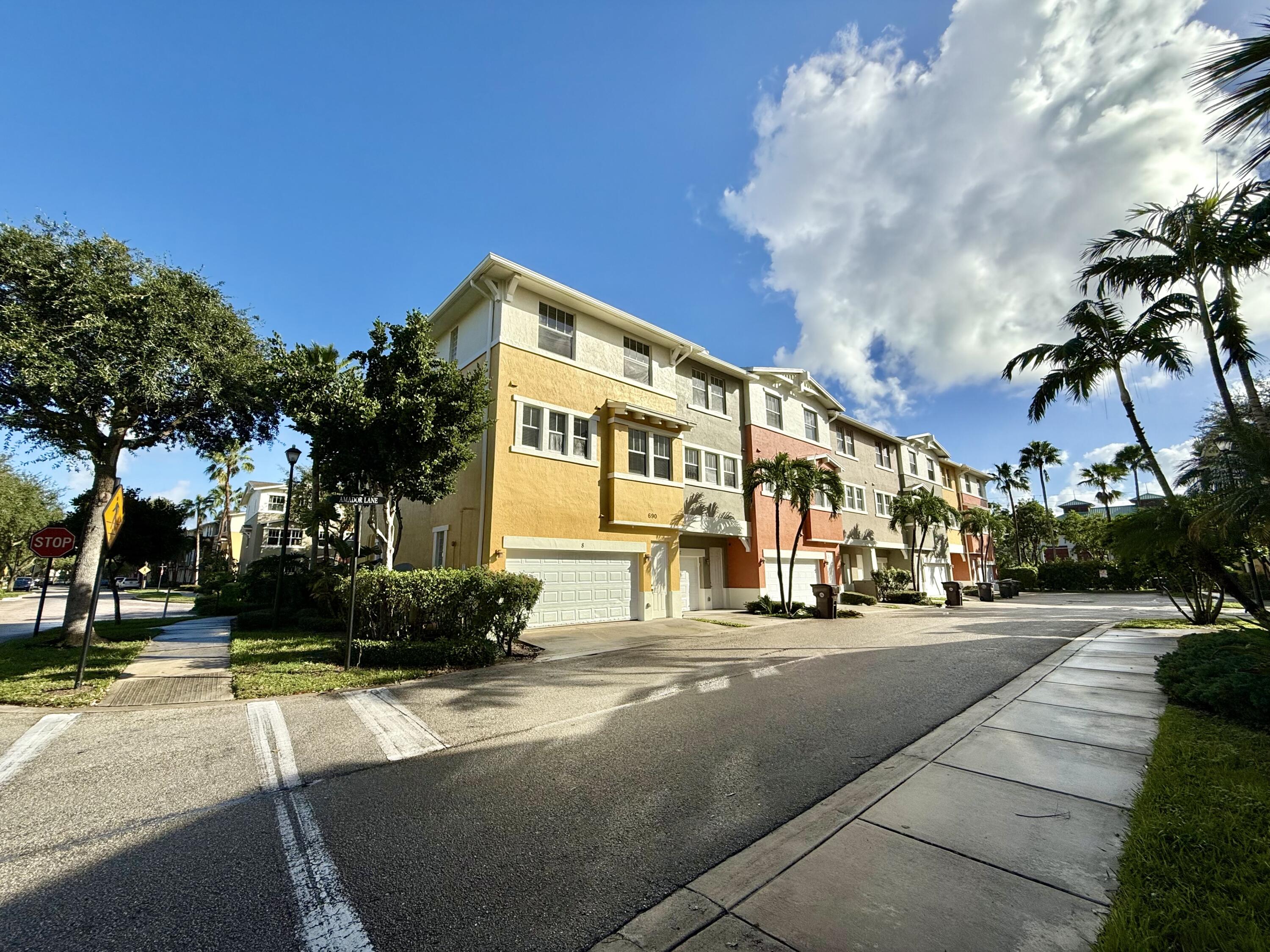 a city street lined with buildings and trees