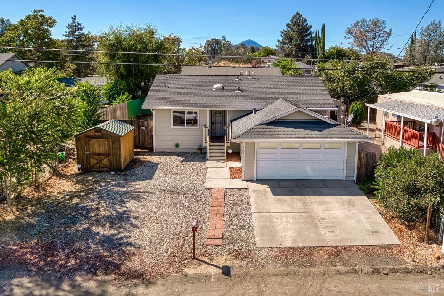 an aerial view of a house with a yard