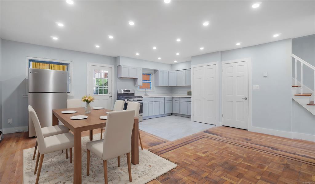 Dining area with light parquet floors