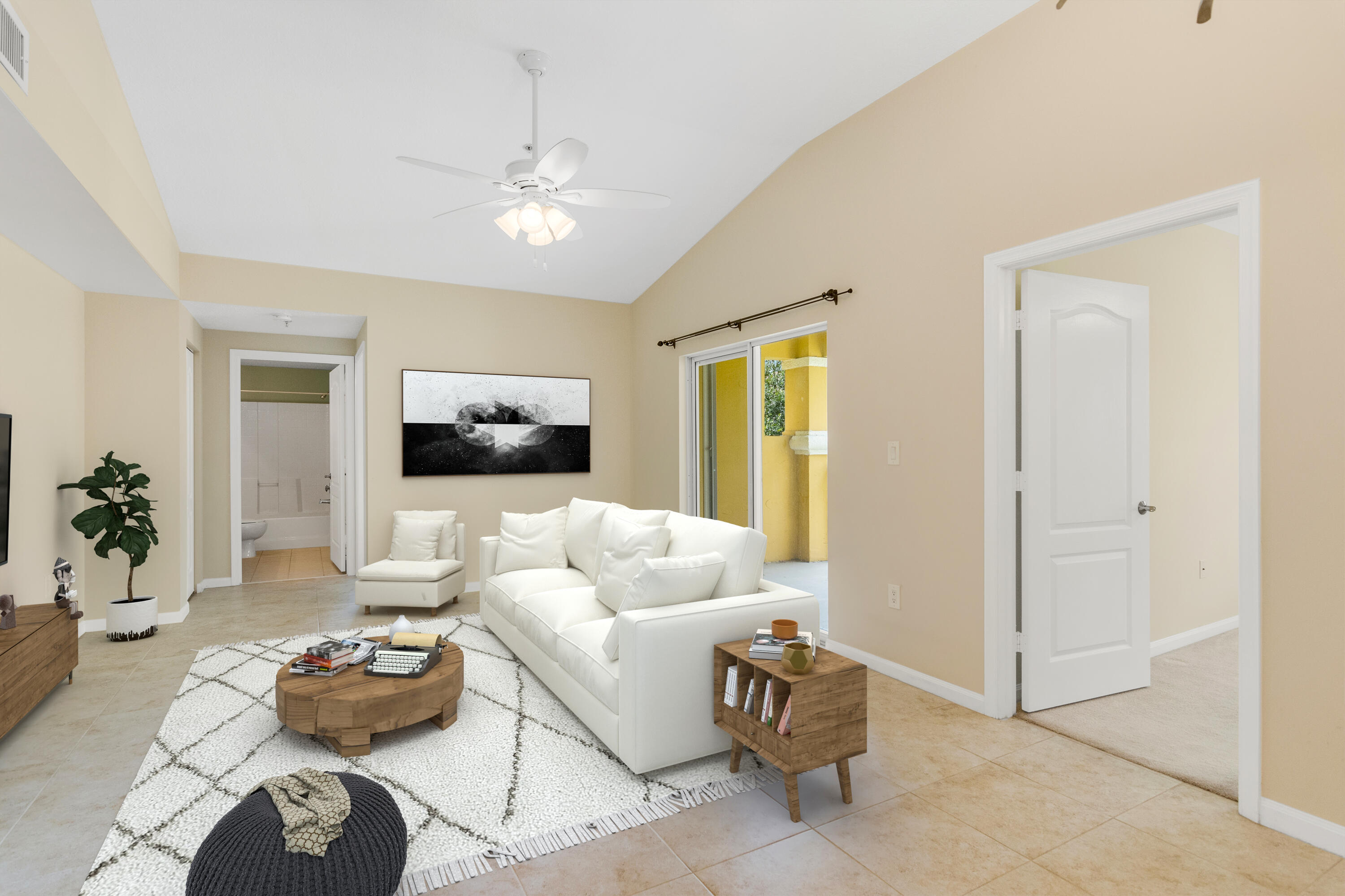 a living room with furniture and a chandelier