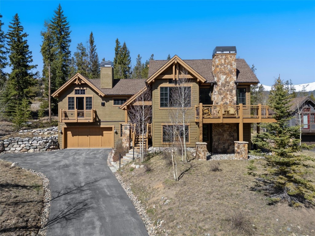 Craftsman inspired home with a garage and a balcony