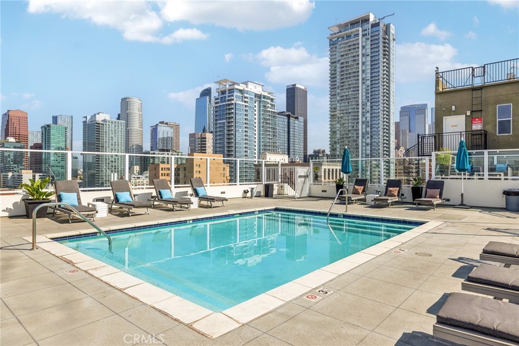 a view of swimming pool with outdoor seating