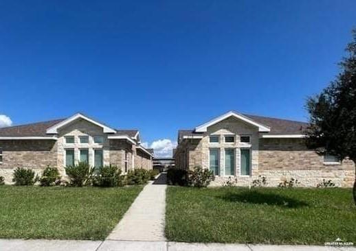 View of front of house with a front yard