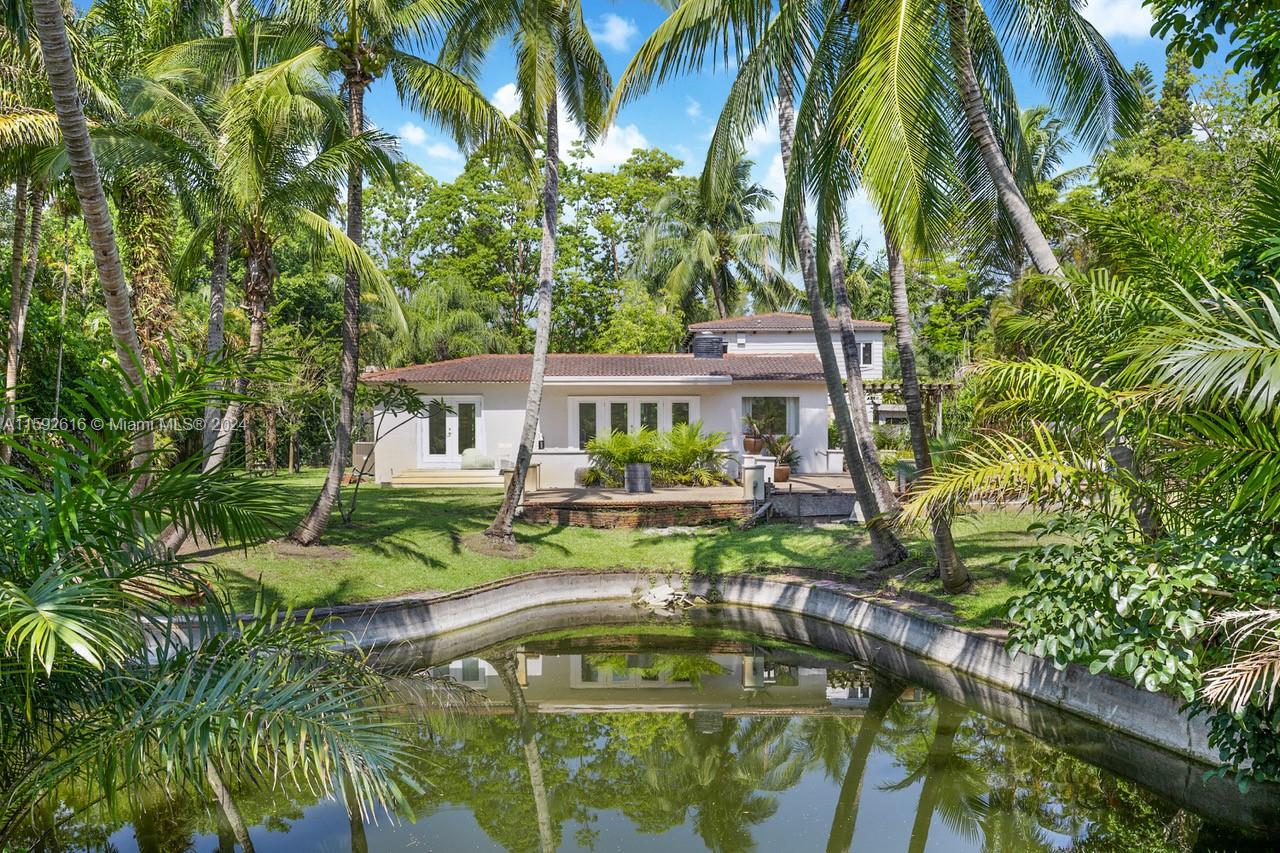 a house with swimming pool in a yard