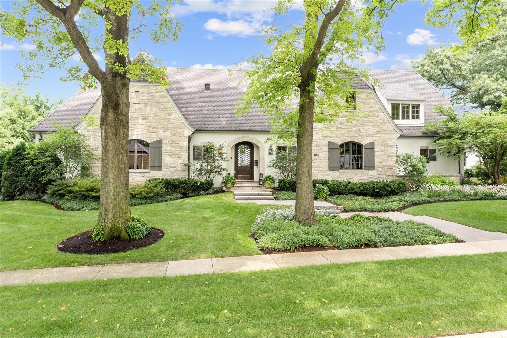 a front view of a house with garden