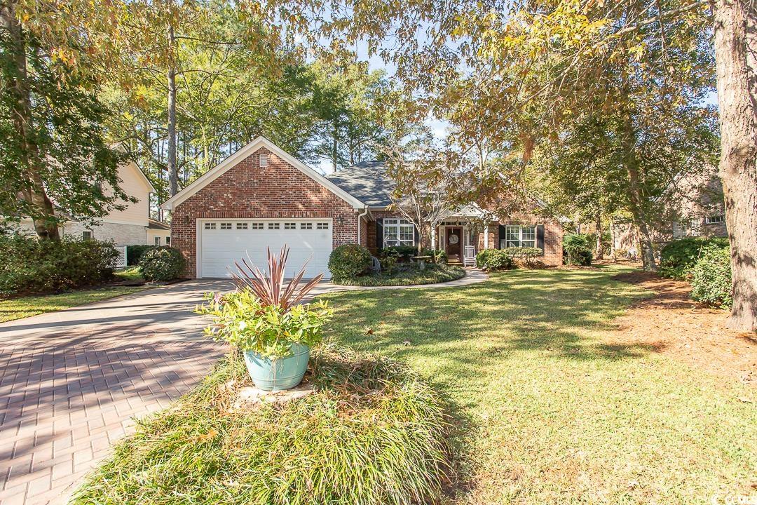 View of front of house featuring a front yard and