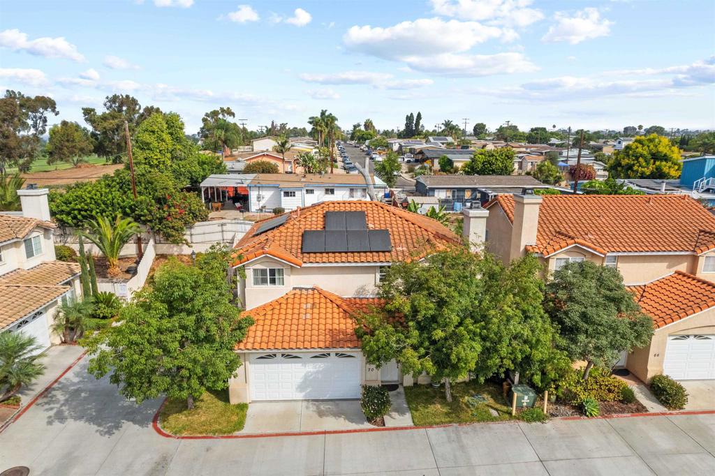 an aerial view of a house with a garden