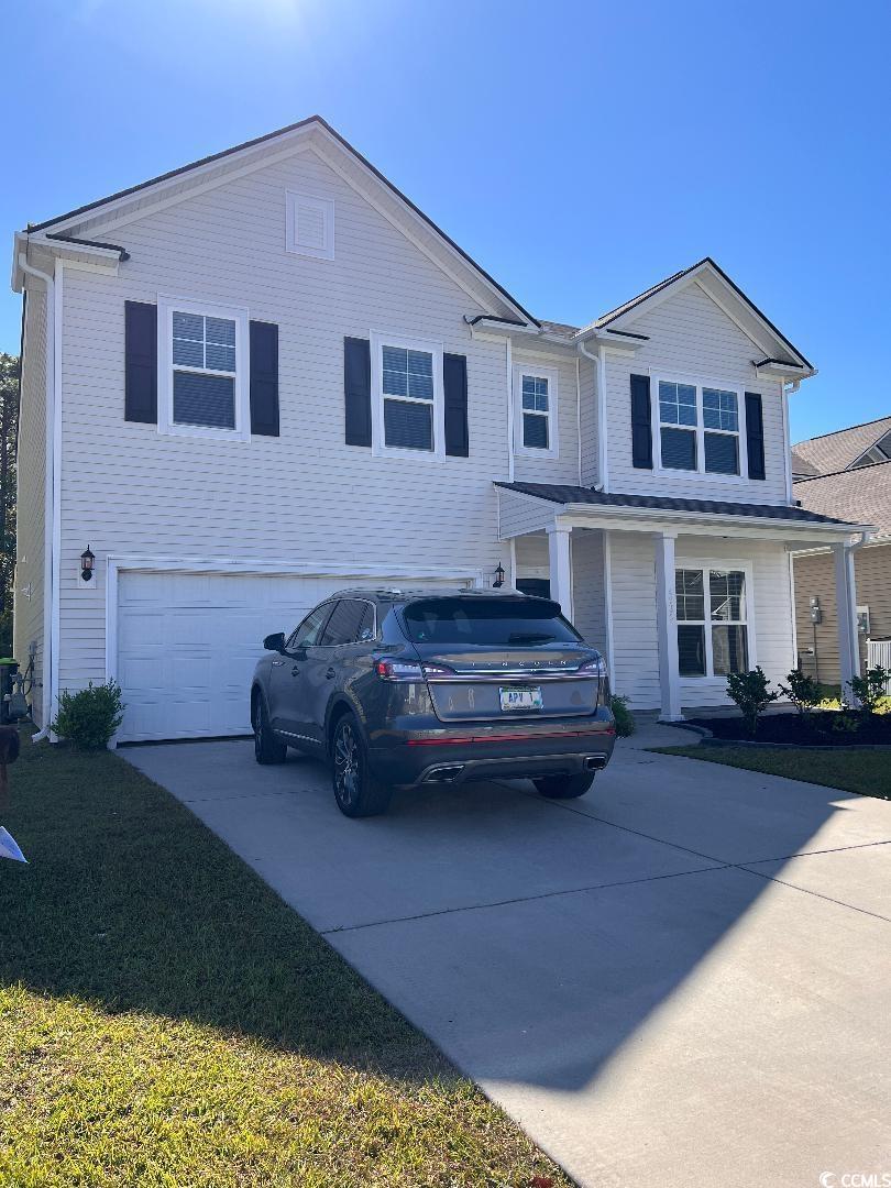 View of front of house featuring a garage