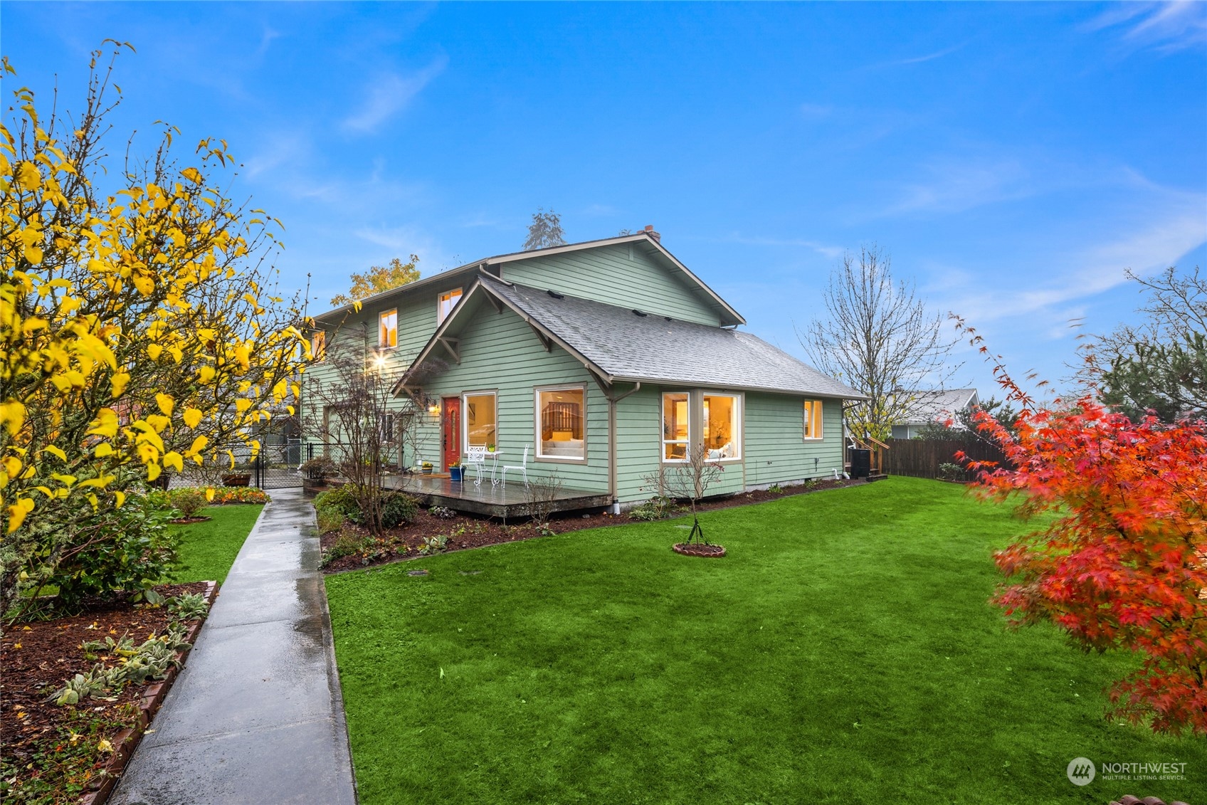 a front view of a house with a yard