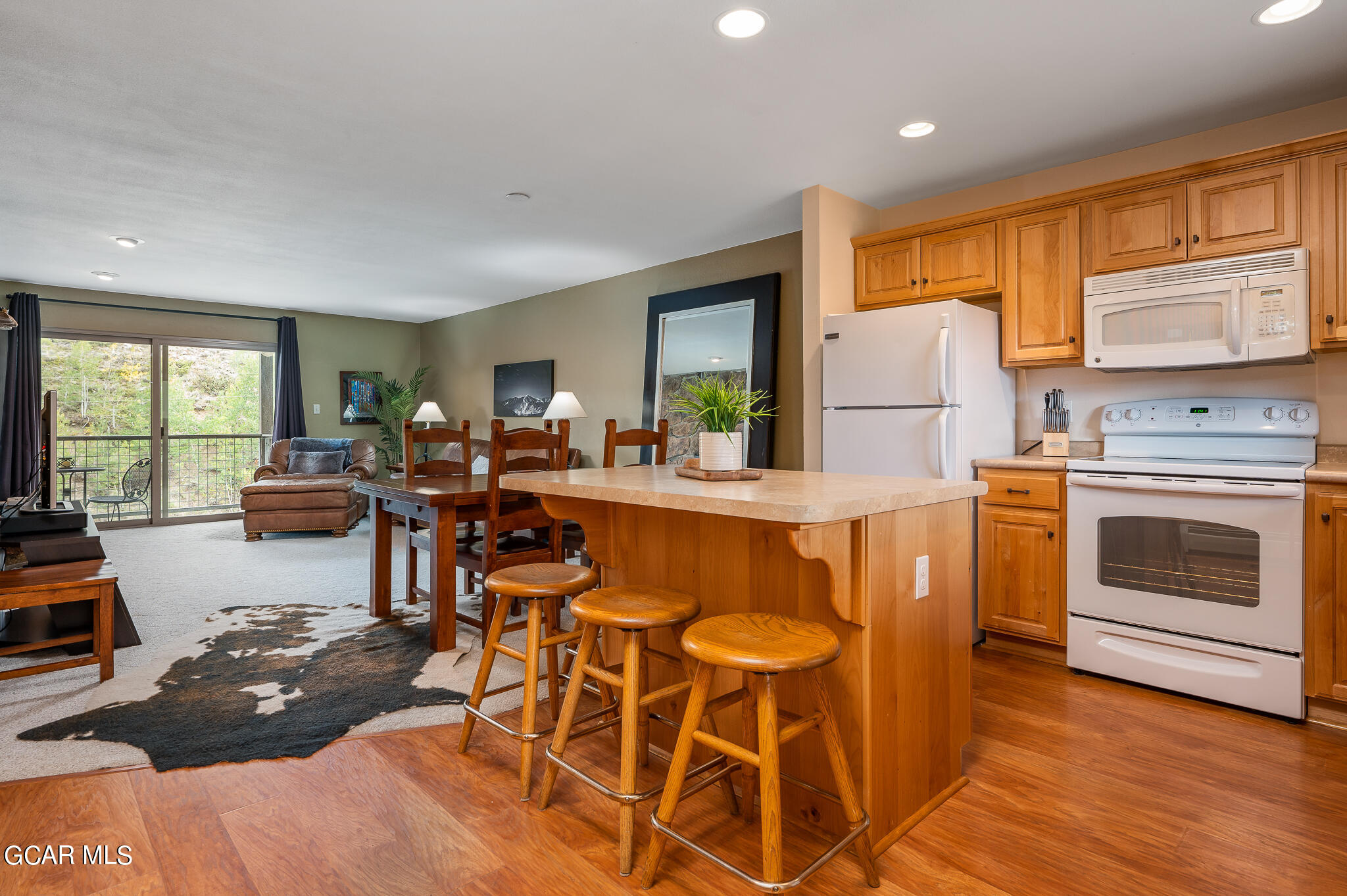 a view of a kitchen and dining room