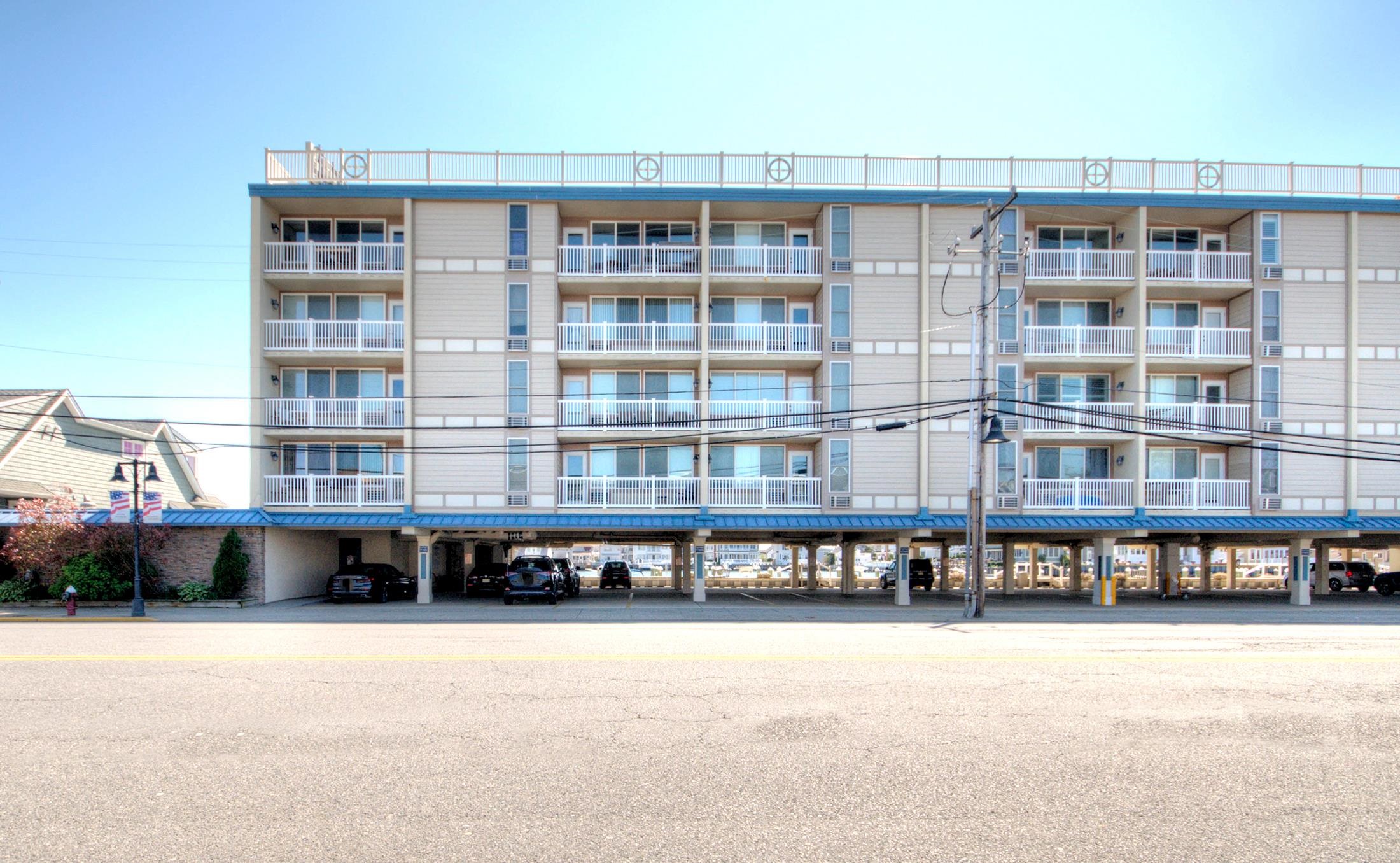 a view of a large building with a swimming pool