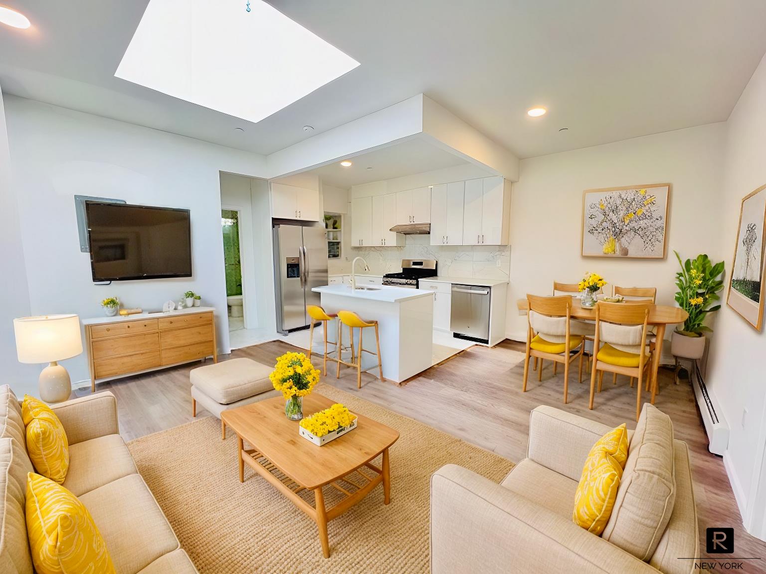 a living room with furniture and a flat screen tv