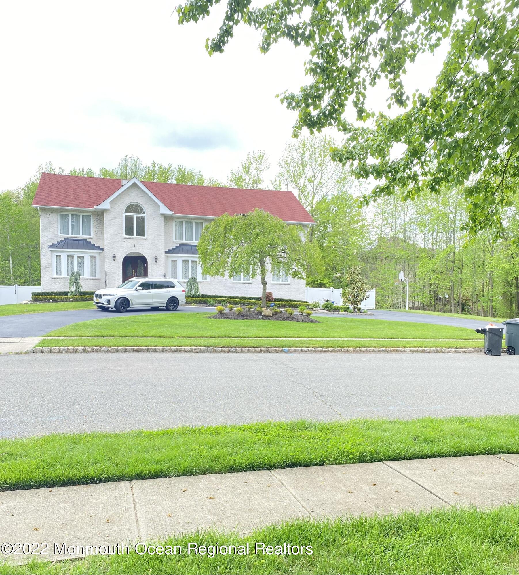 a house with a yard and a large trees