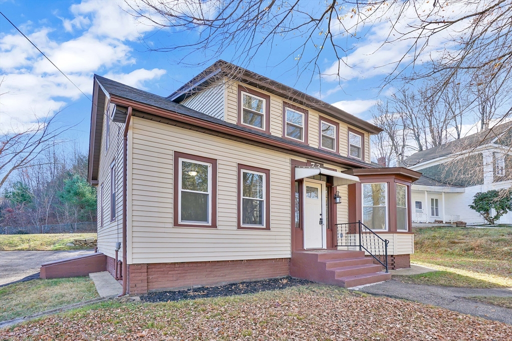 a front view of a house with a yard