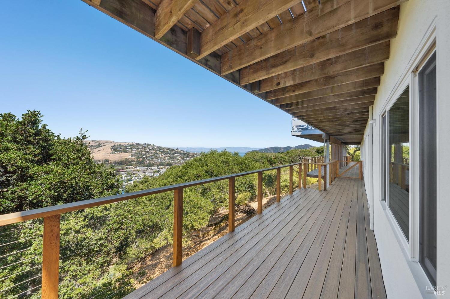 a view of balcony with wooden floor