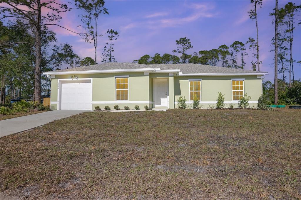 front view of a house with a yard