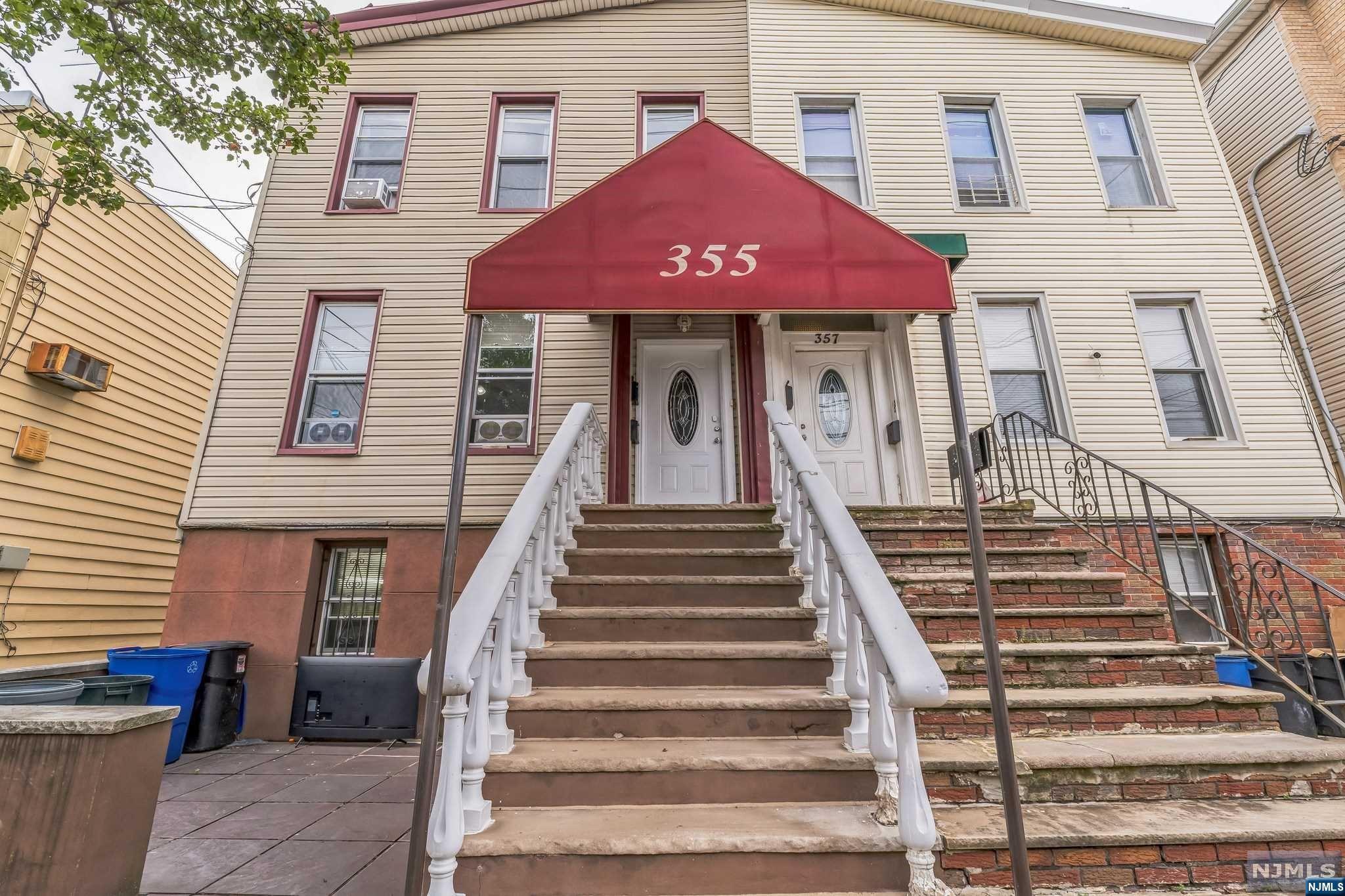 a front view of a house with a stairs