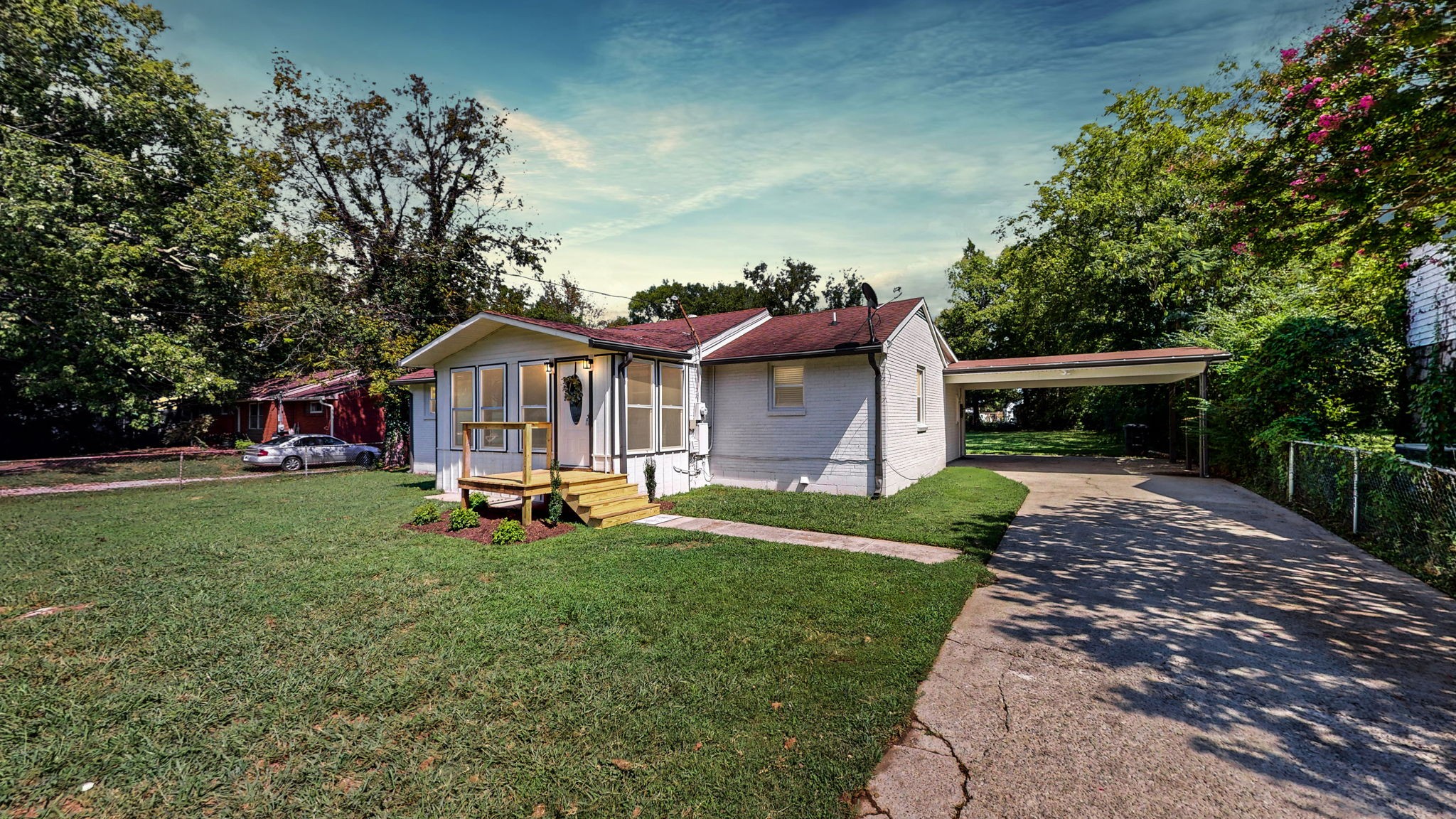 a front view of a house with garden