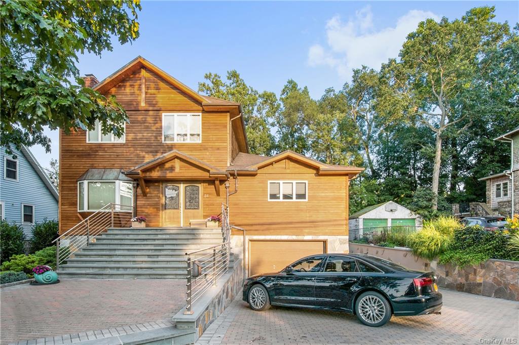 View of front of property featuring a garage