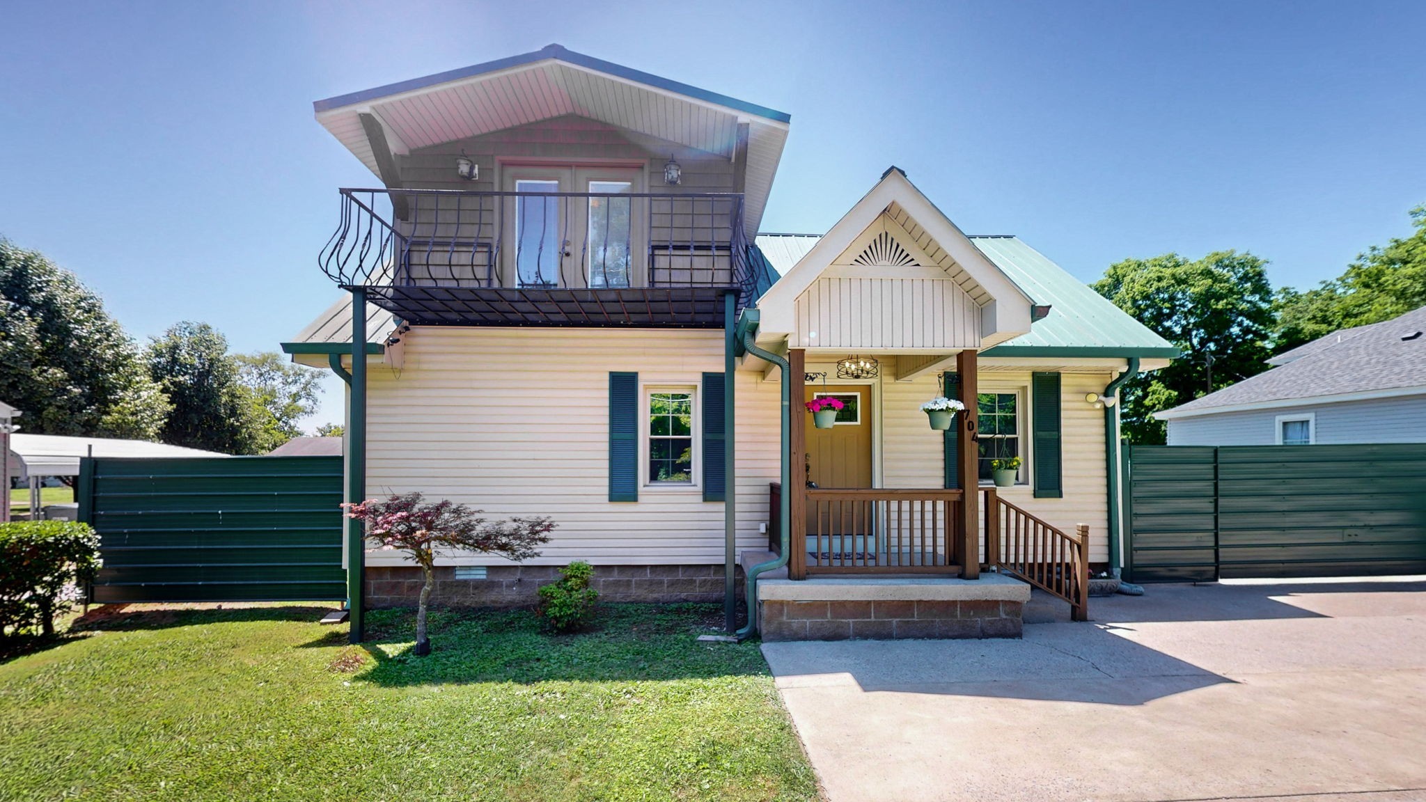 a front view of a house with garden