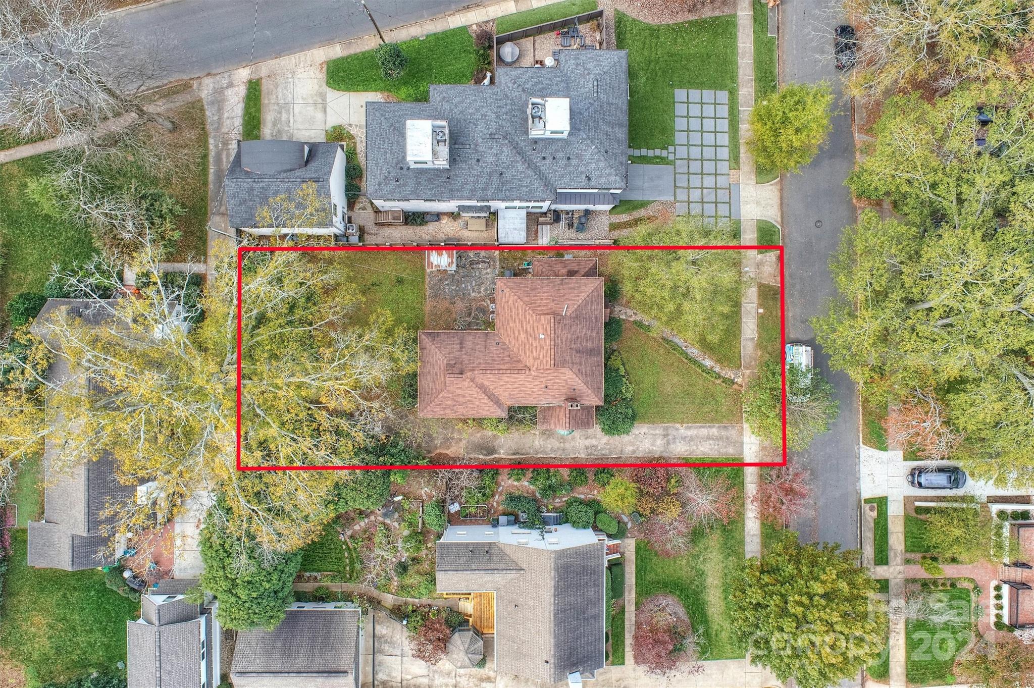 aerial view of a houses with street