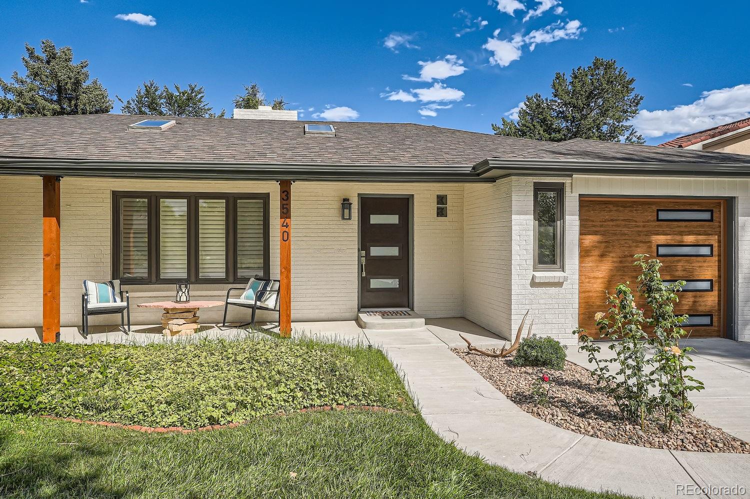 a front view of a house with garden