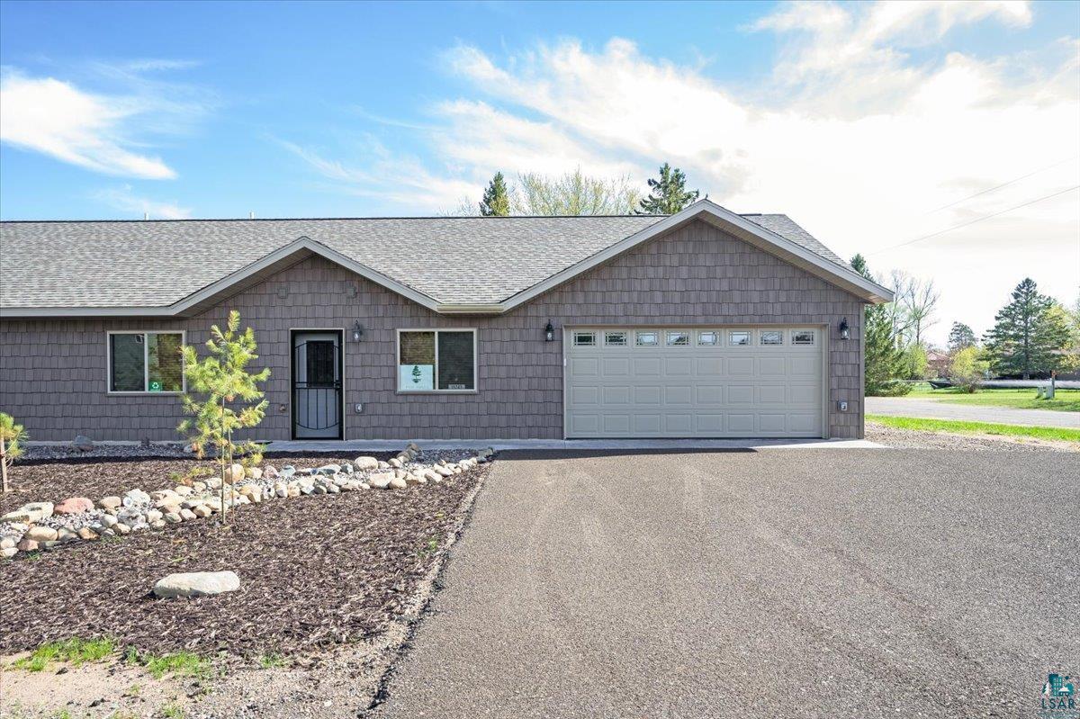 Ranch-style home featuring a garage