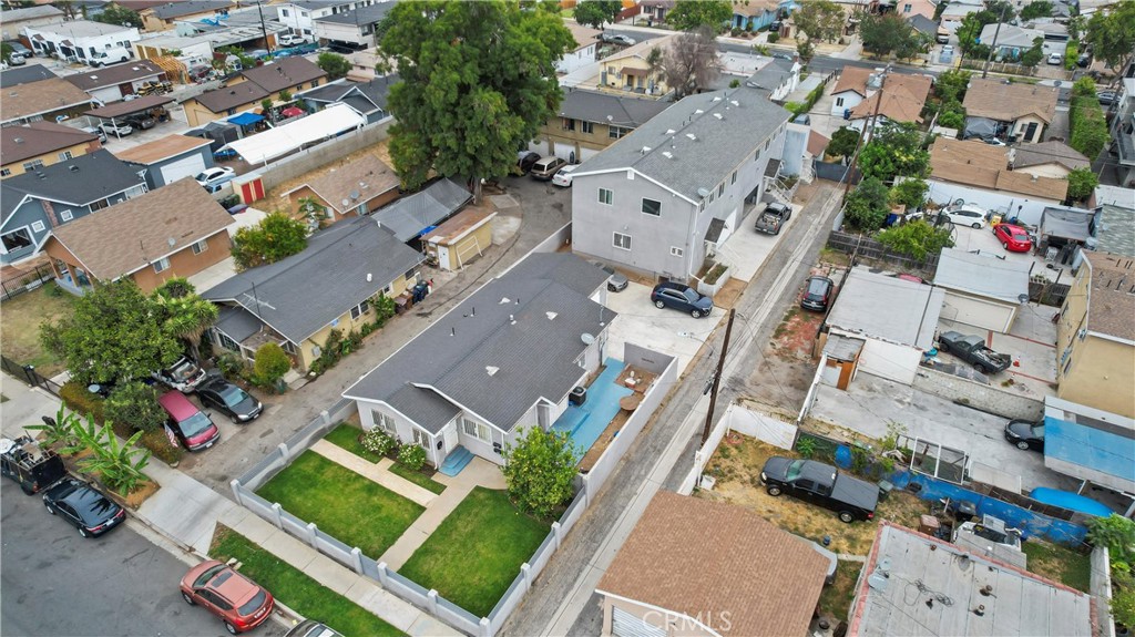 an aerial view of residential houses with outdoor space