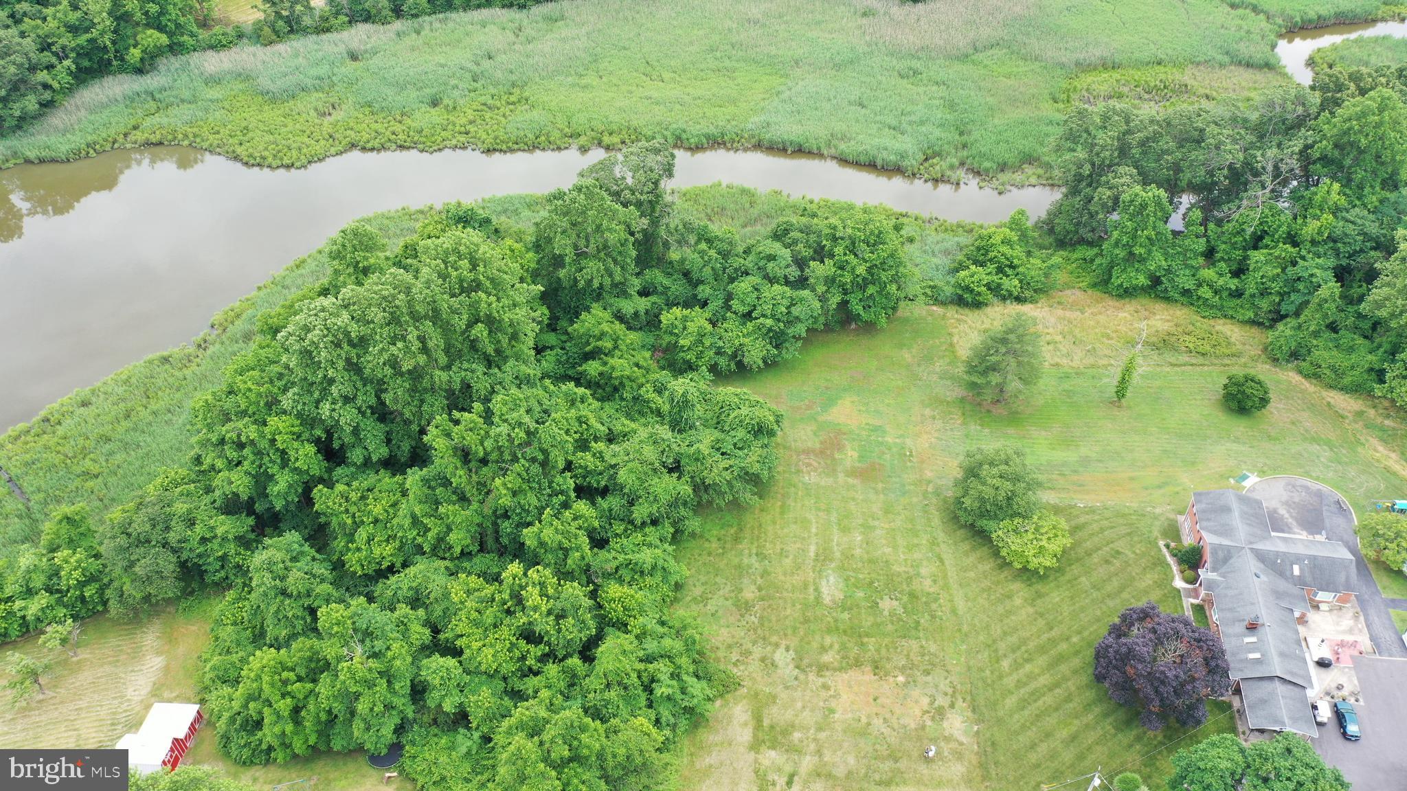 a view of a lake with a yard