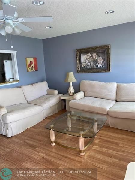 a living room with furniture and a rug