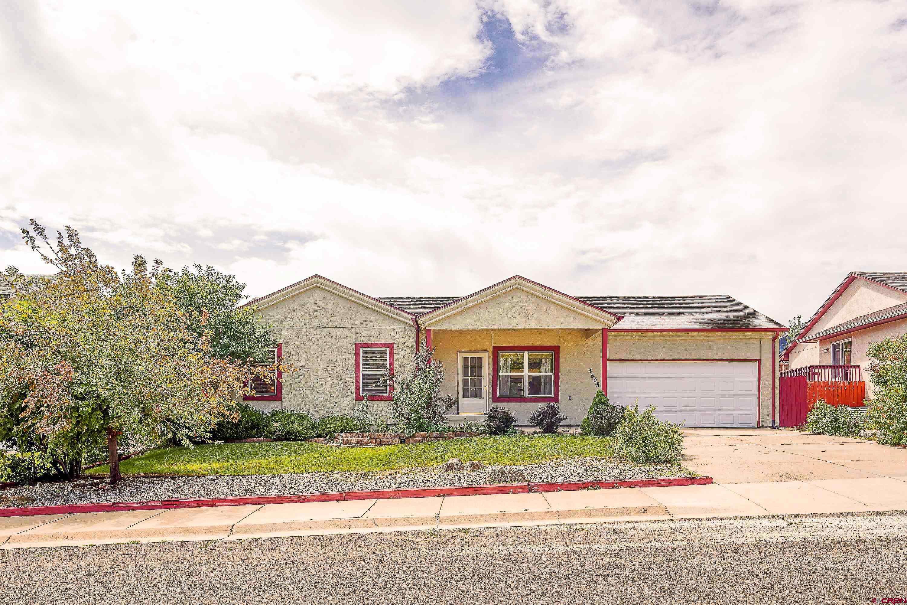 front view of a house and a yard