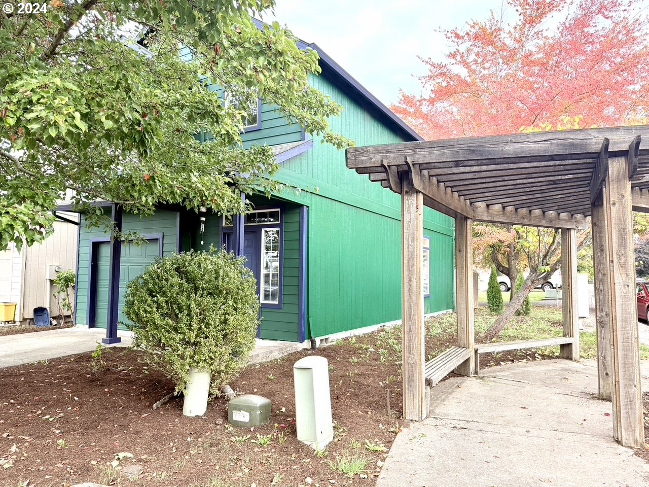 a front view of a house with garden