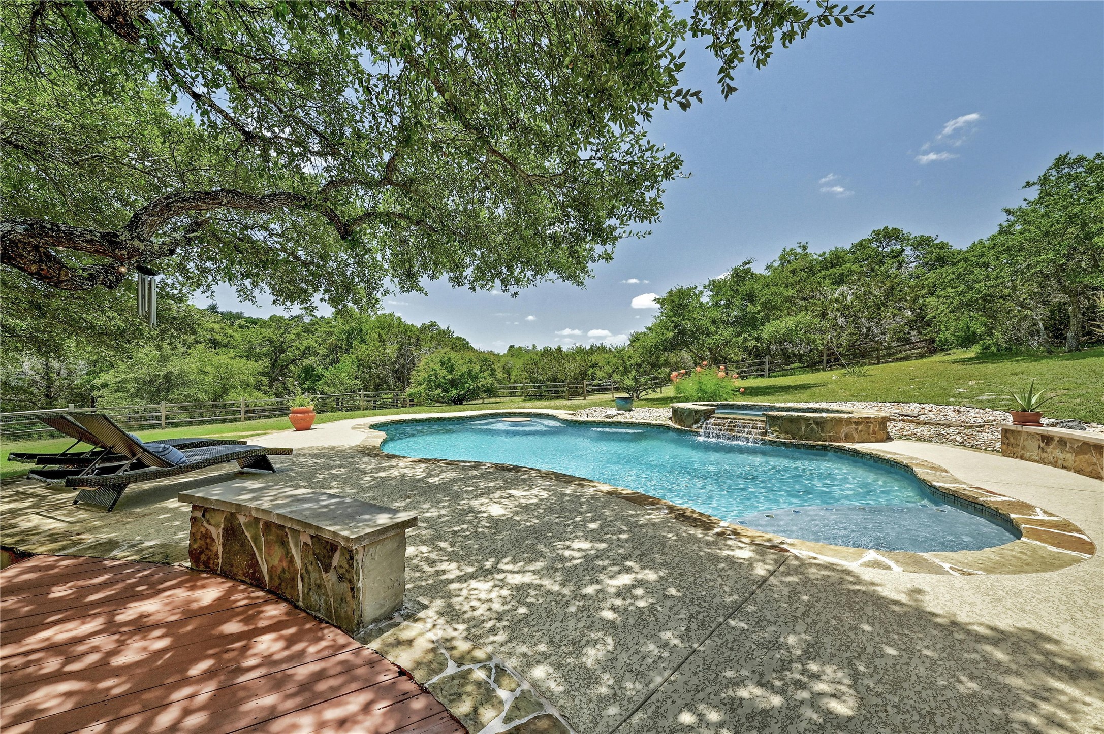 a view of a backyard with swimming pool