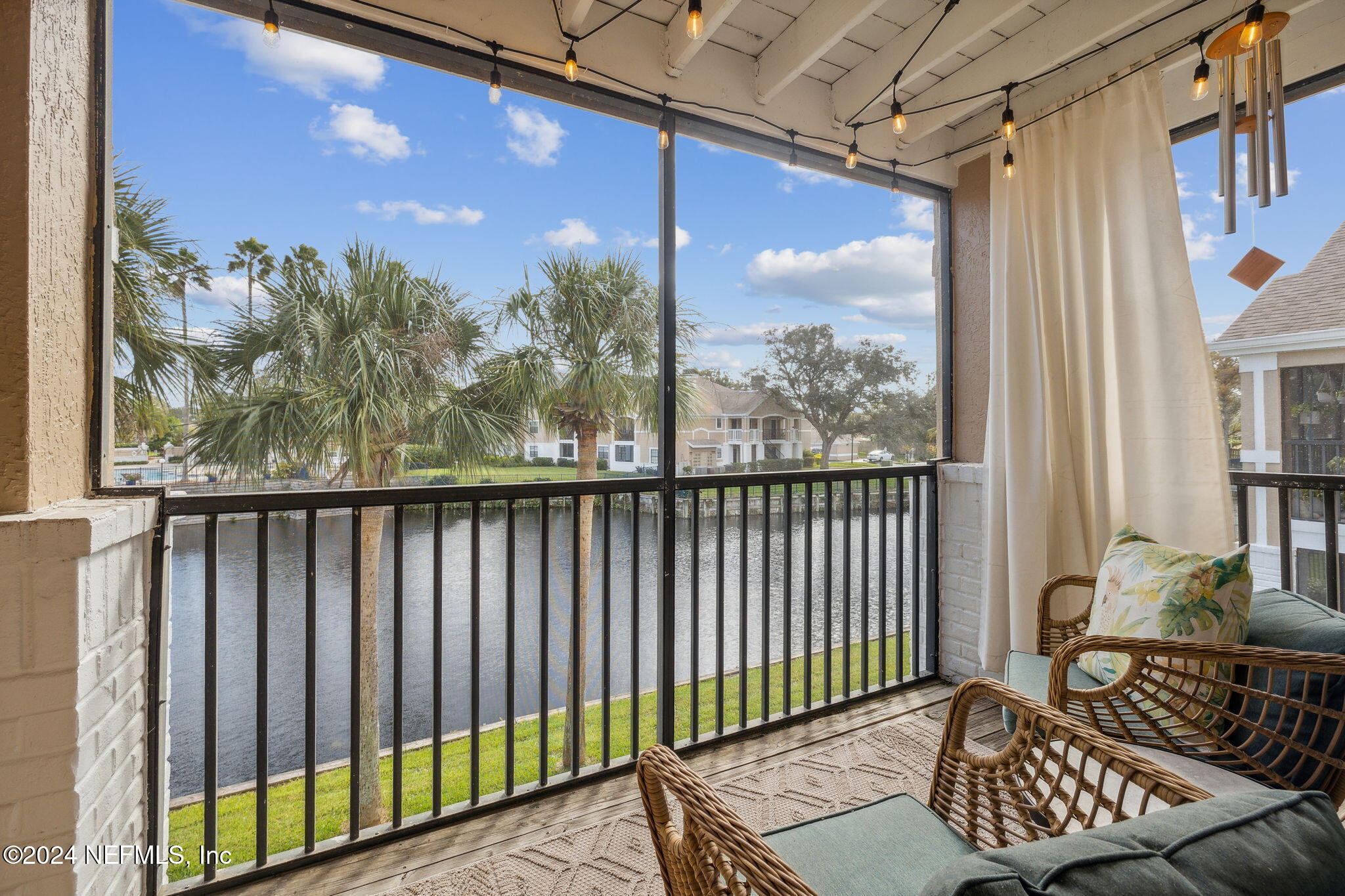 a view of balcony with furniture