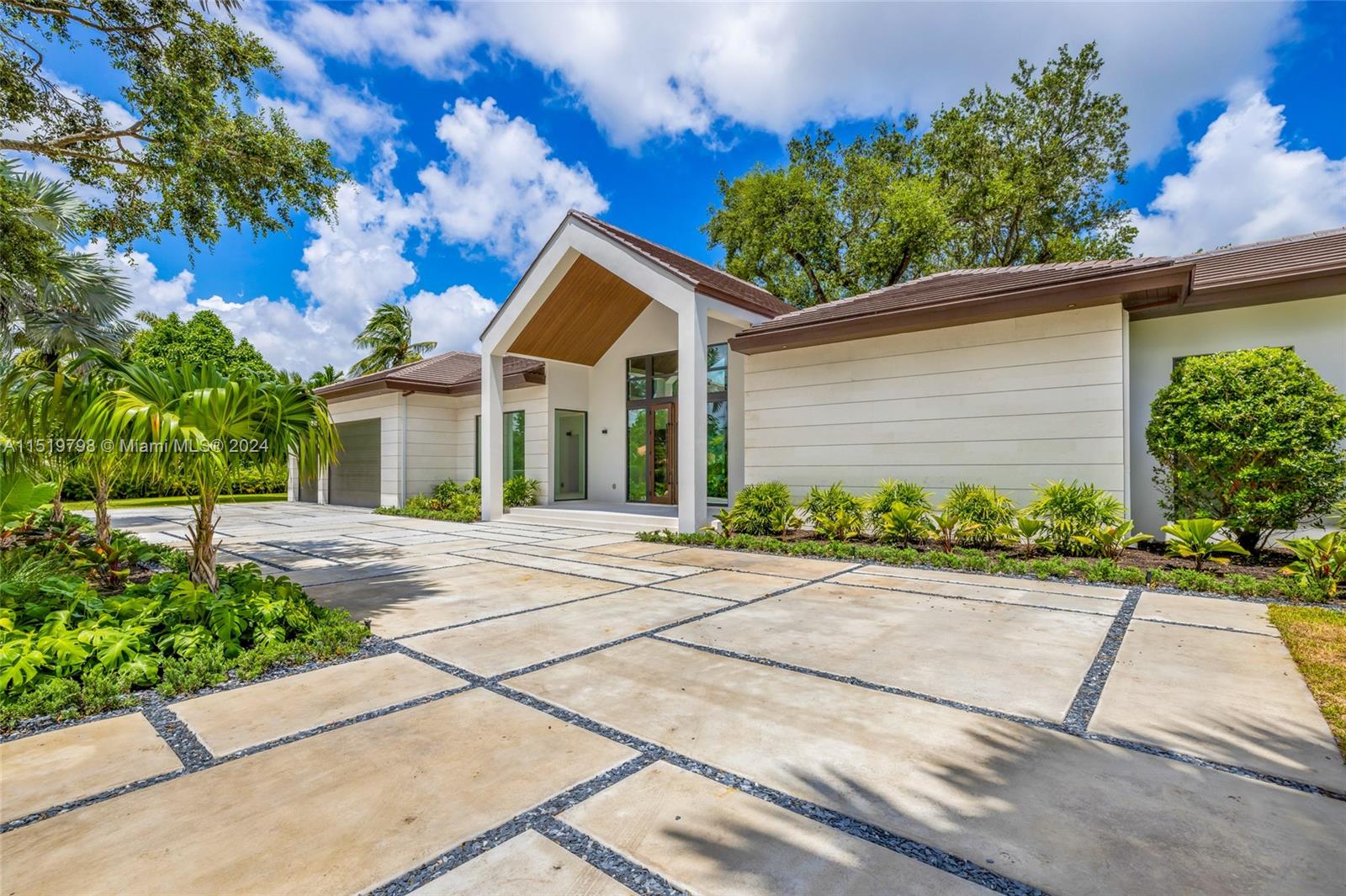 a view of a house with a yard and plants