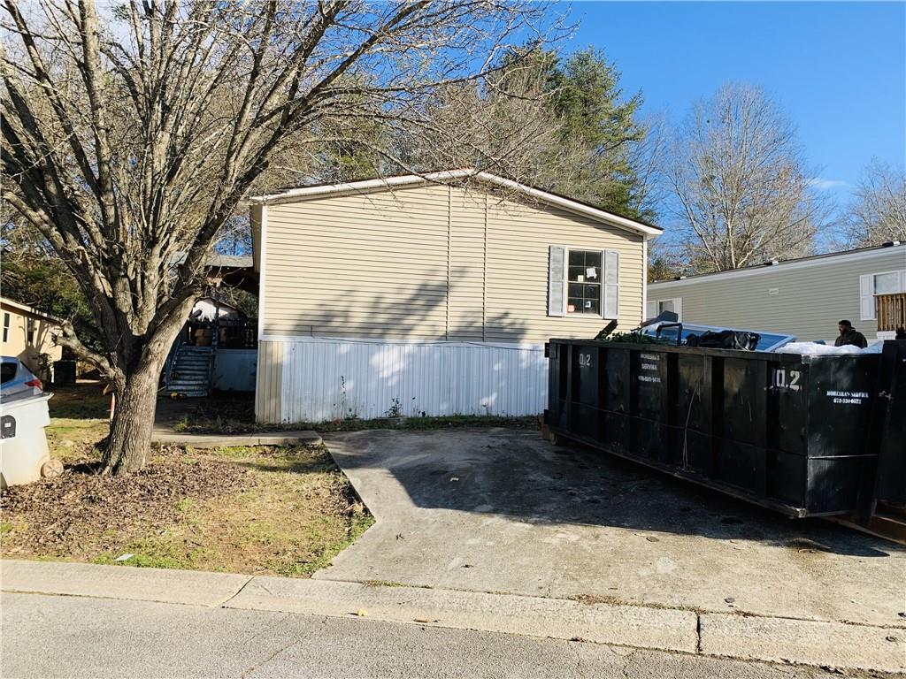 a backyard of a house with wooden fence