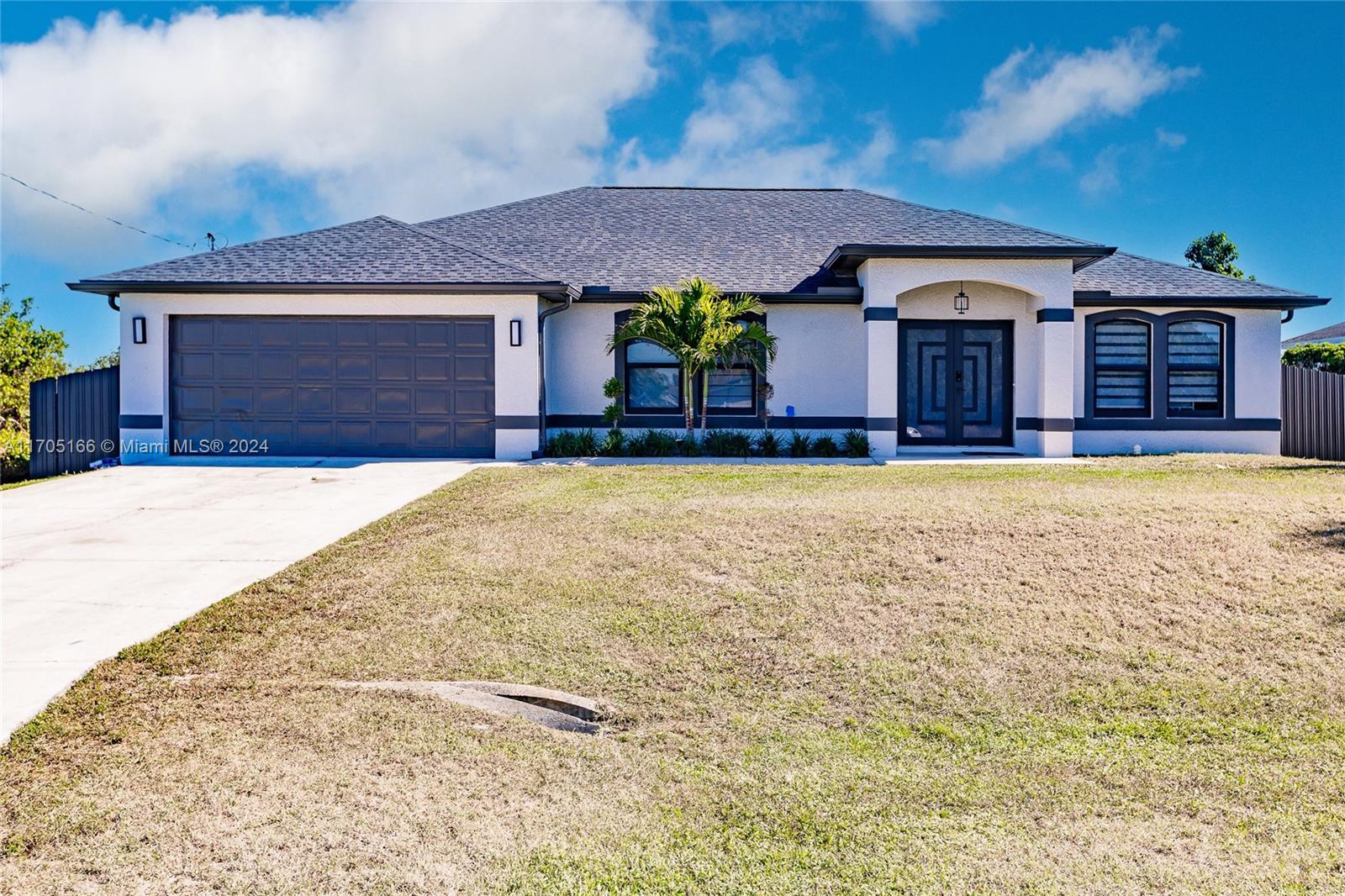 a view of a house with swimming pool and a yard