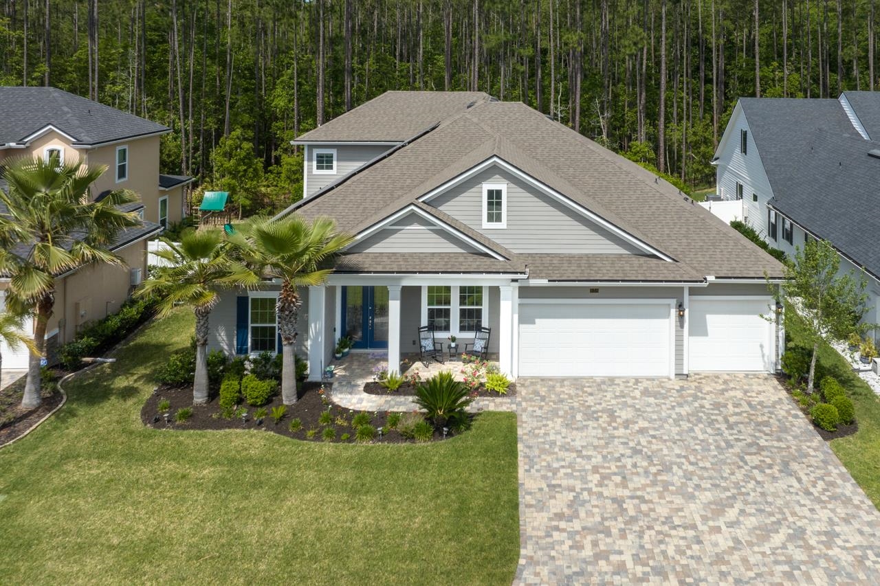 a front view of a house with garden