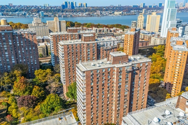 a view of a lake with tall buildings