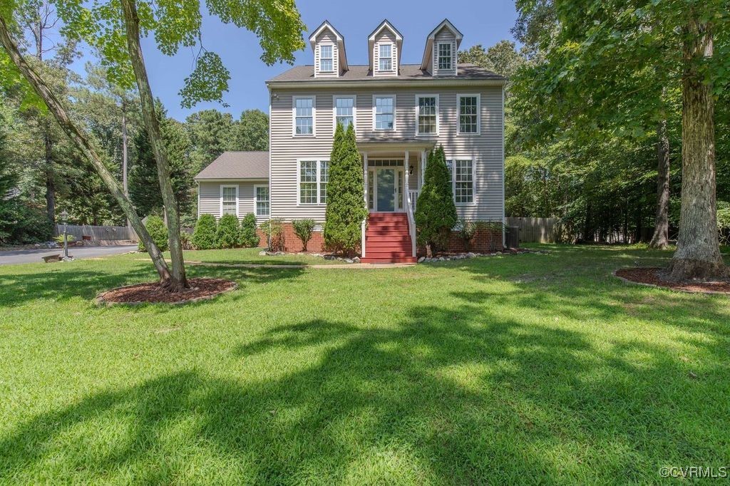 a view of a big yard in front of a house