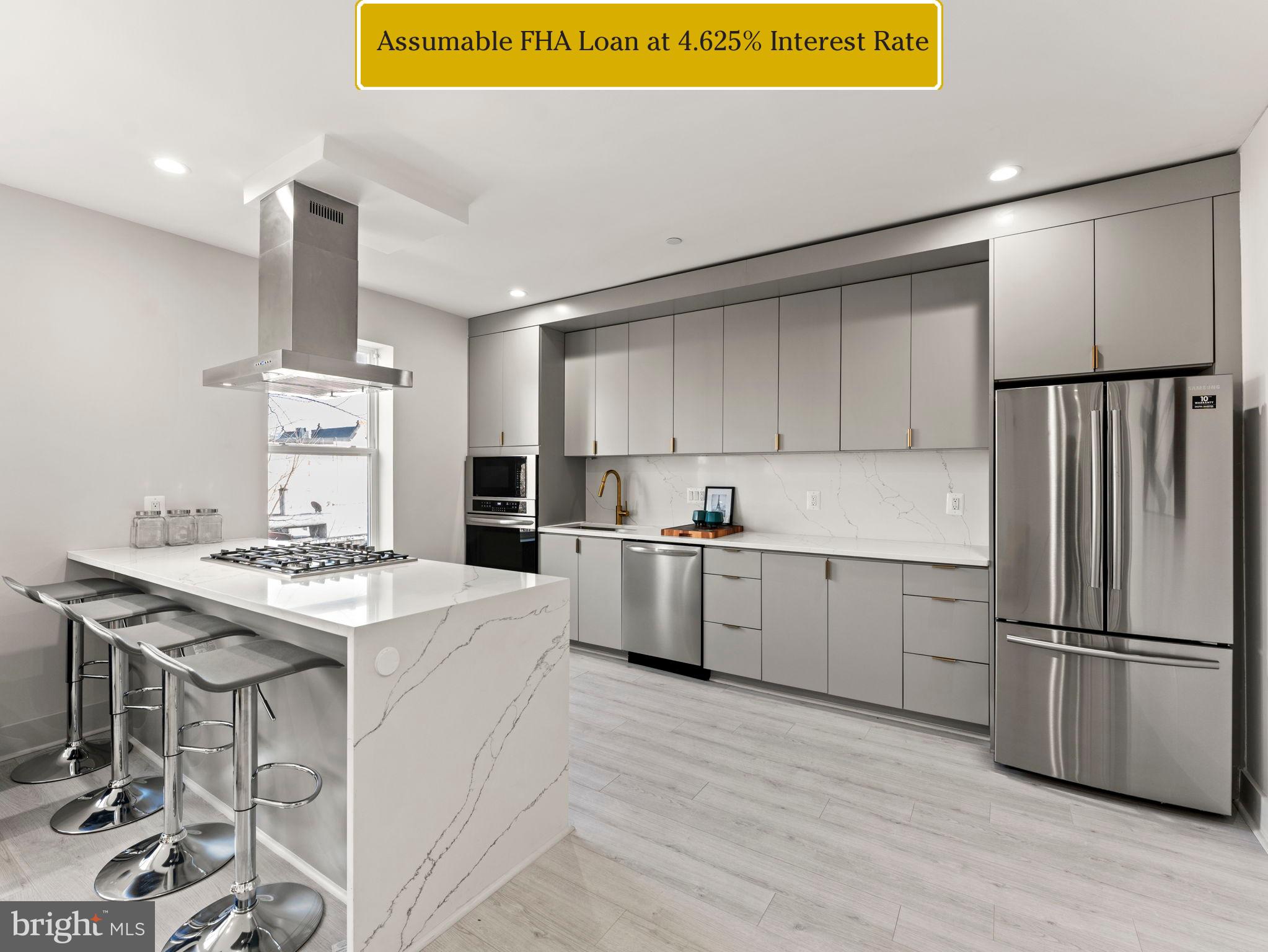 a kitchen with appliances cabinets and a counter top space