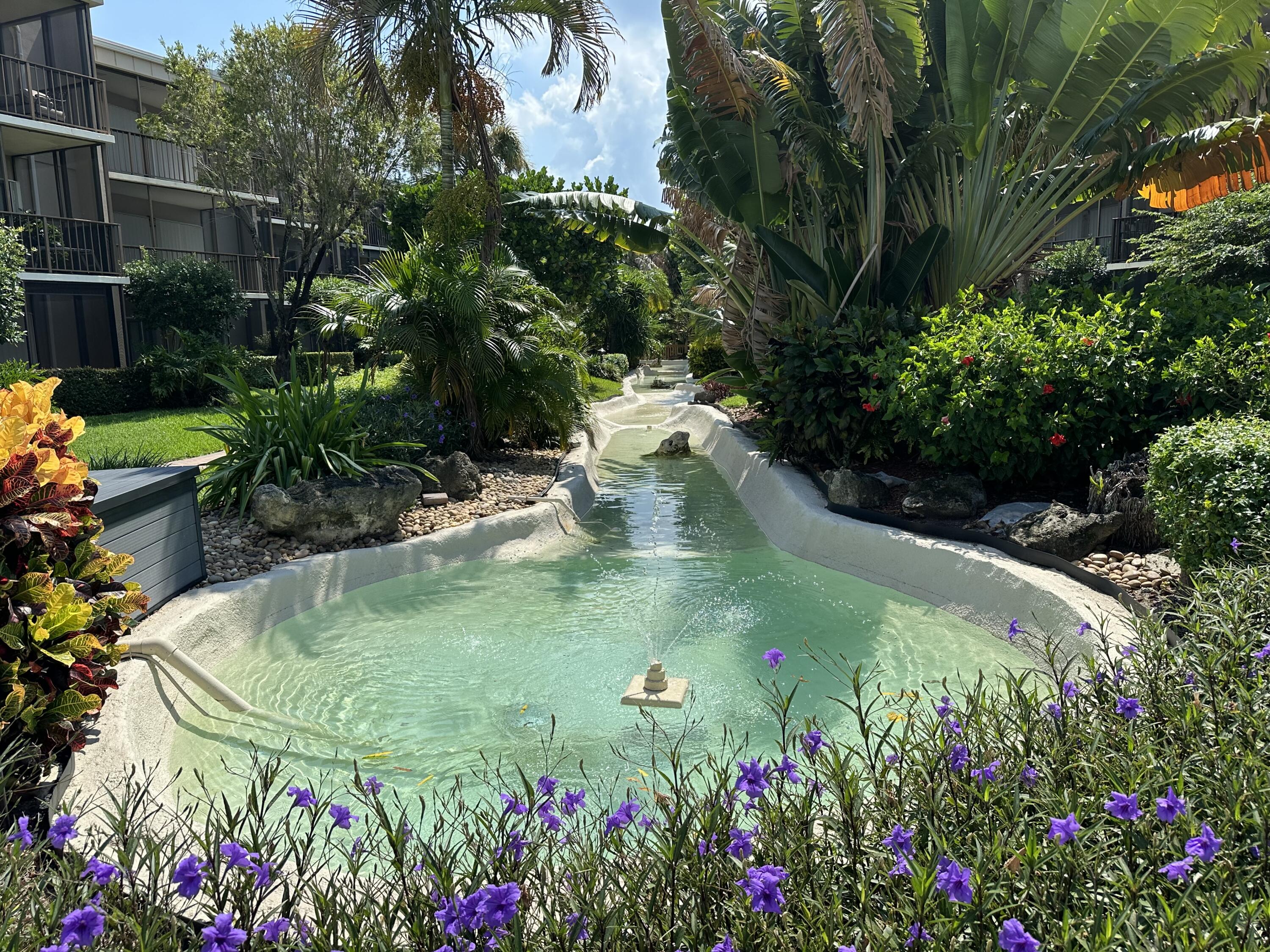 a view of a garden with a fountain