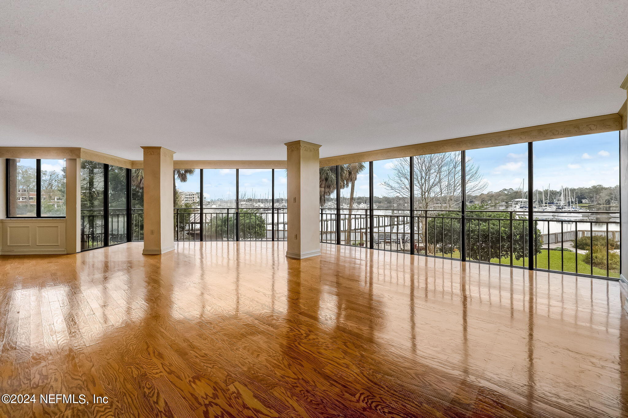 a view of an entryway with wooden floor