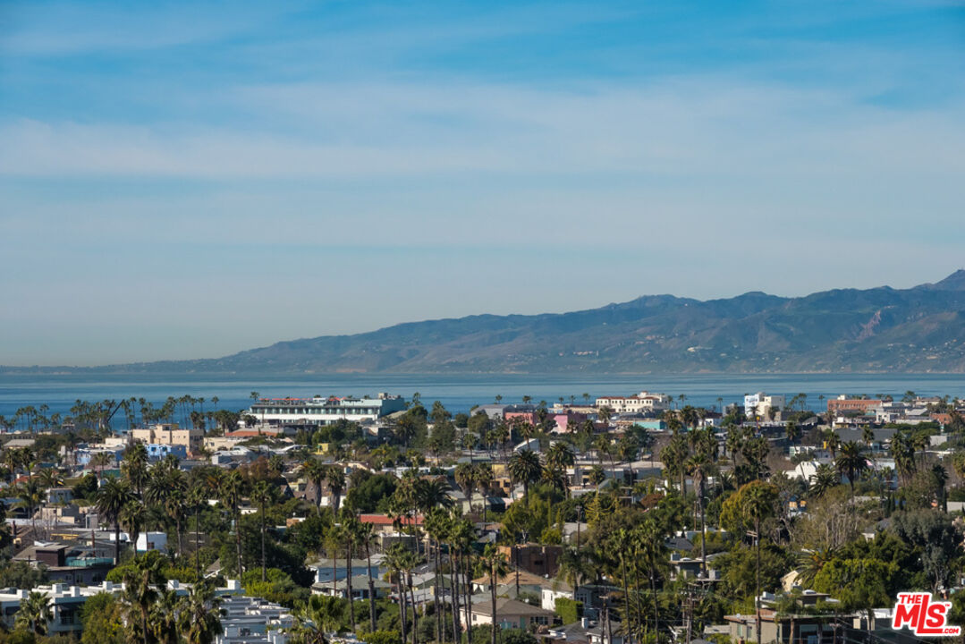 a view of a large body of water with lots of trees in all around