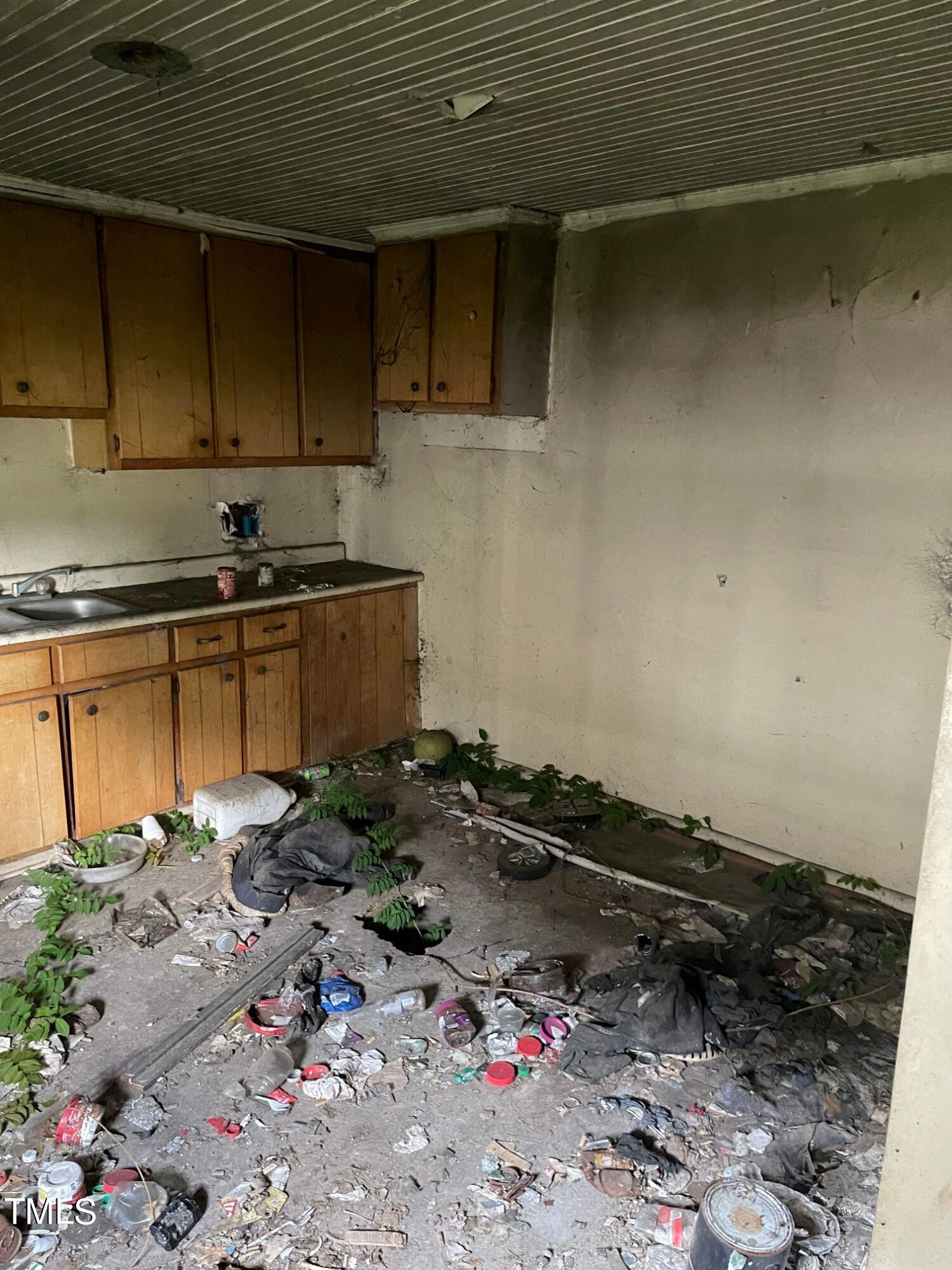 a kitchen with a sink and cabinets